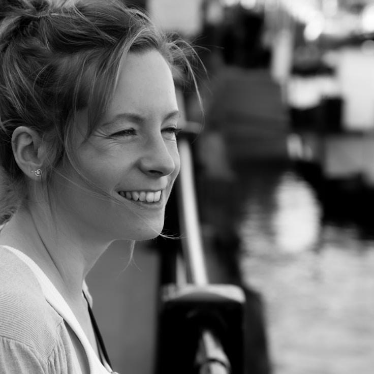 Ariya Sharma, Lead Design Curator at Verdant & Vine, reviewing corporate floral arrangements